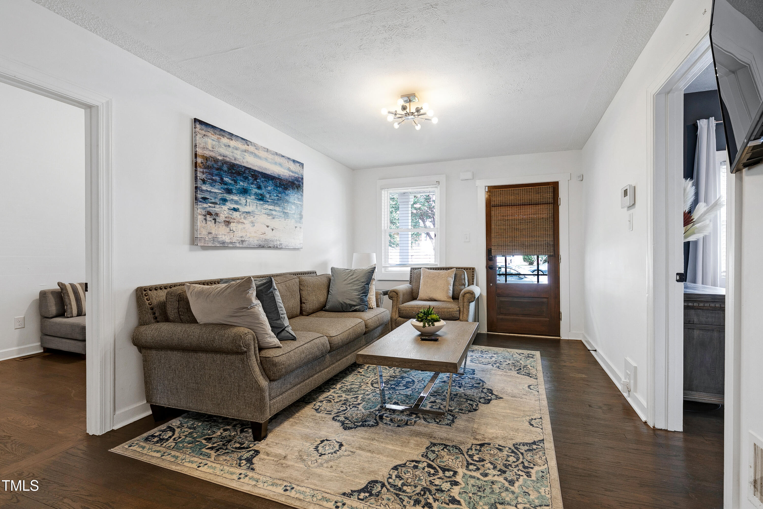 320 East Cabarrus Street Raleigh, NC 27601 - Photo 4 of 30 a living room with furniture and wooden floor