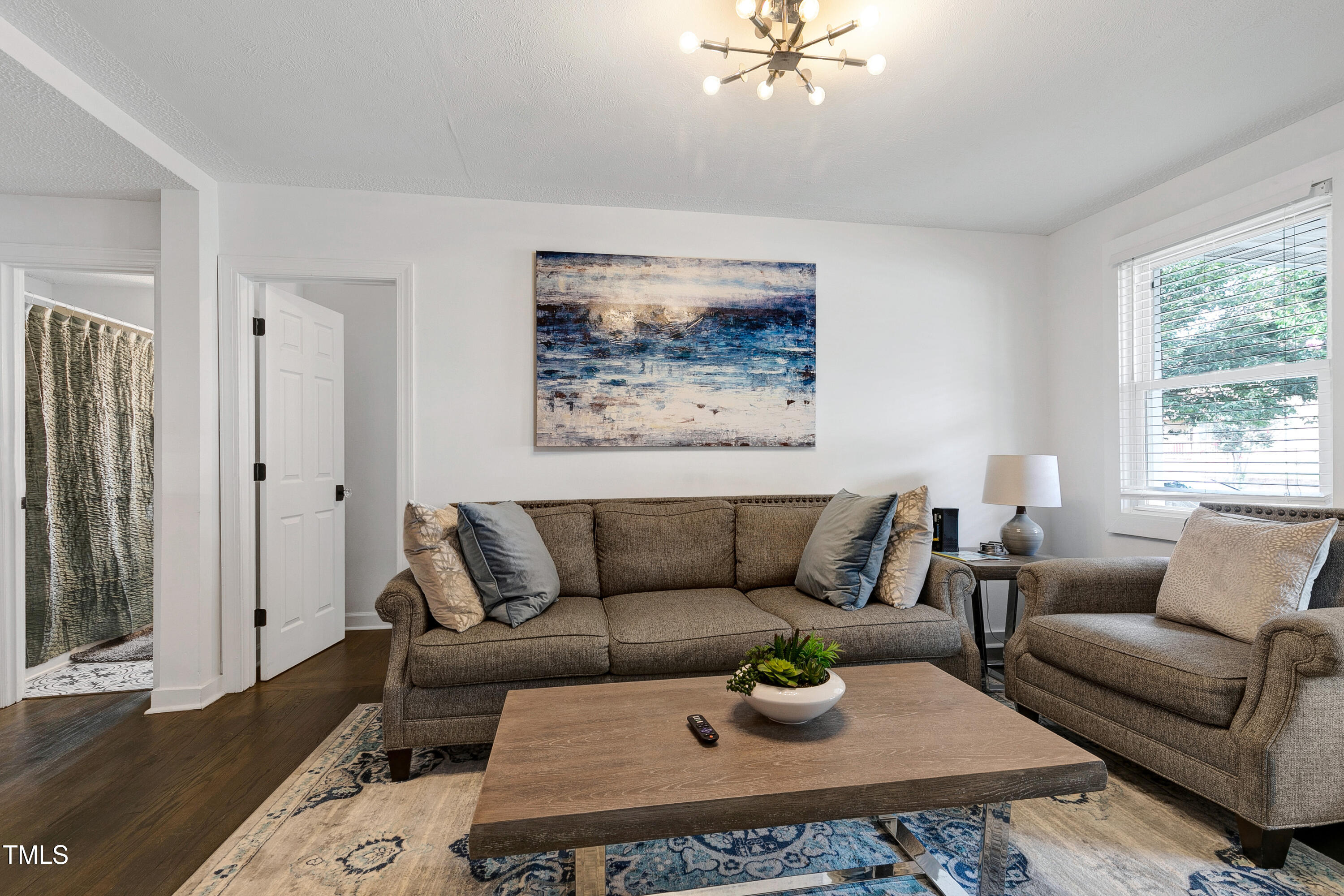320 East Cabarrus Street Raleigh, NC 27601 - Photo 5 of 30 a living room with furniture and a window