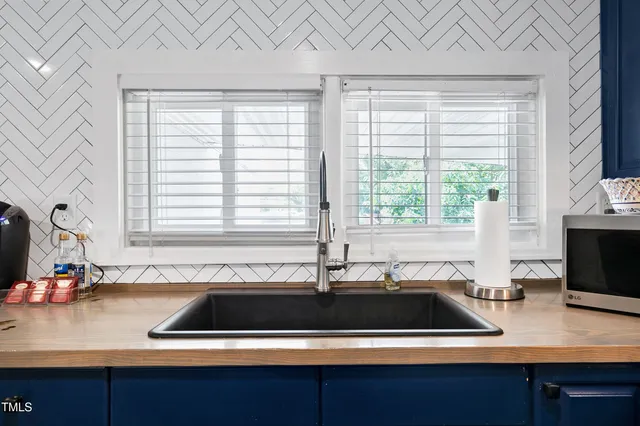 a kitchen with a sink and a window