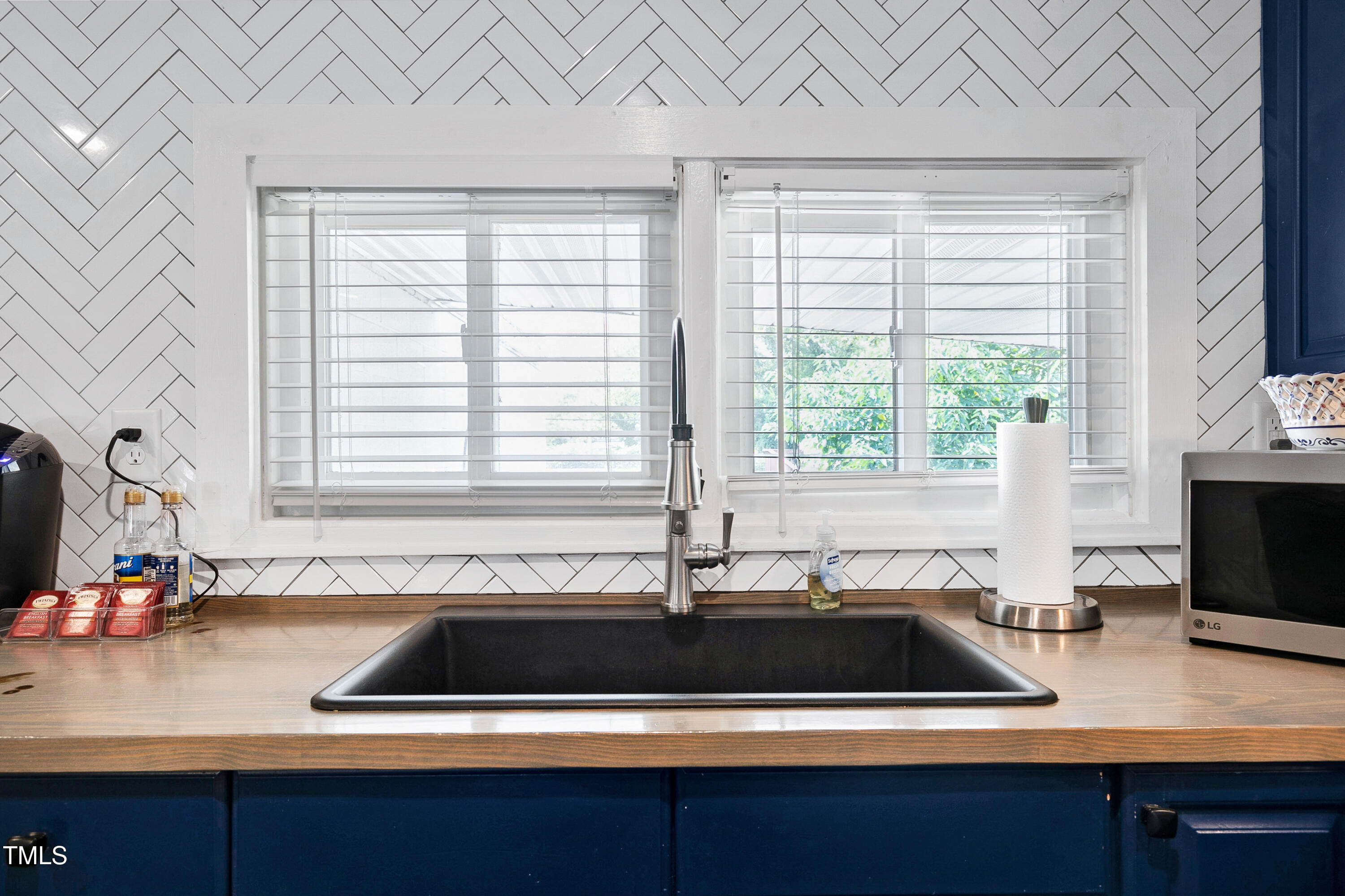 320 East Cabarrus Street Raleigh, NC 27601 - Photo 8 of 30 a kitchen with a sink and a window