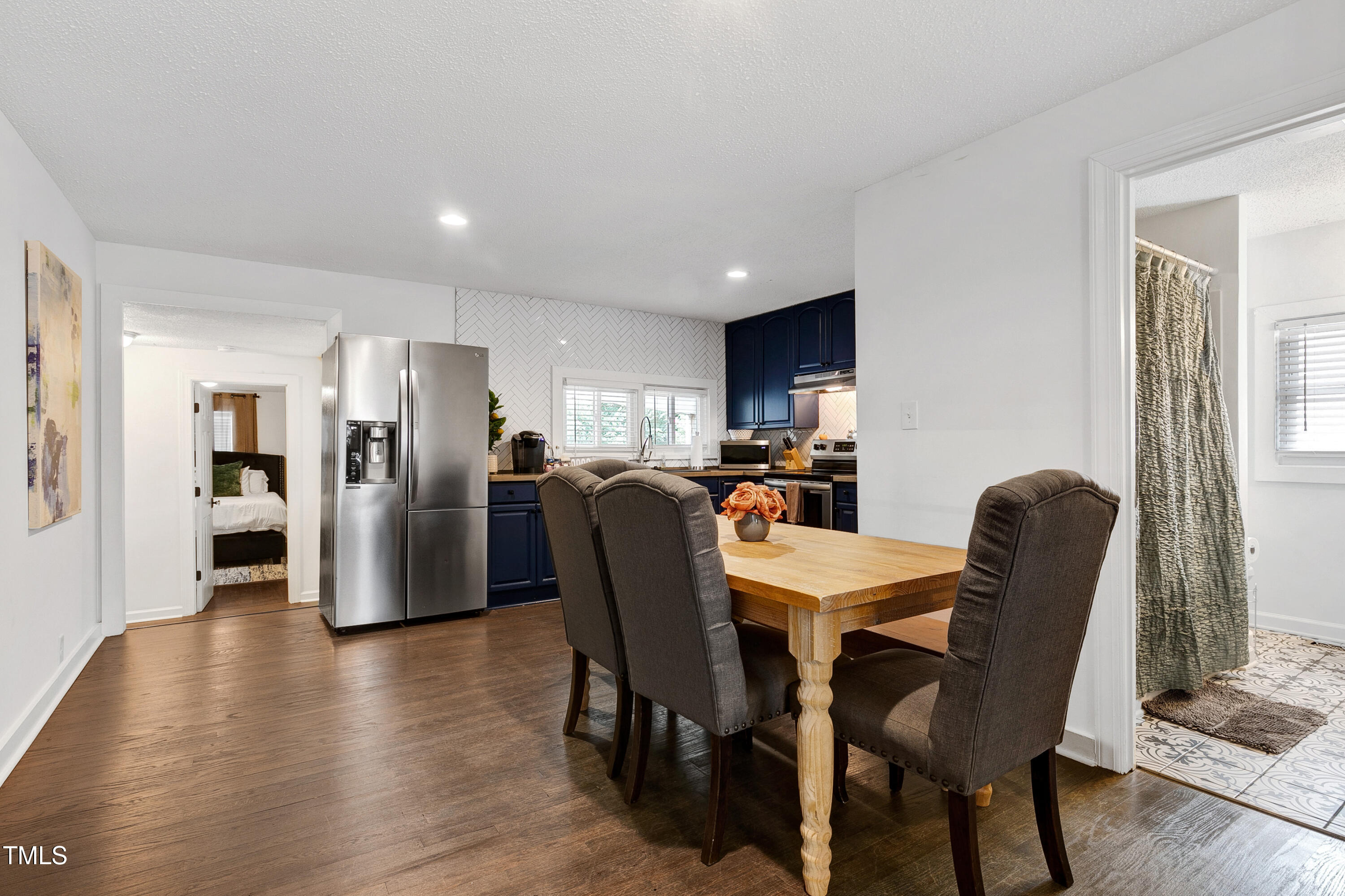 320 East Cabarrus Street Raleigh, NC 27601 - Photo 9 of 30 a view of a dining room with furniture and wooden floor