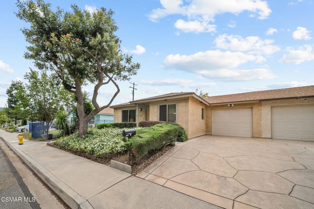 1511 Sequoia Avenue Simi Valley, CA 93063 - Photo 28 of 30 a white house that has a tree in front of it