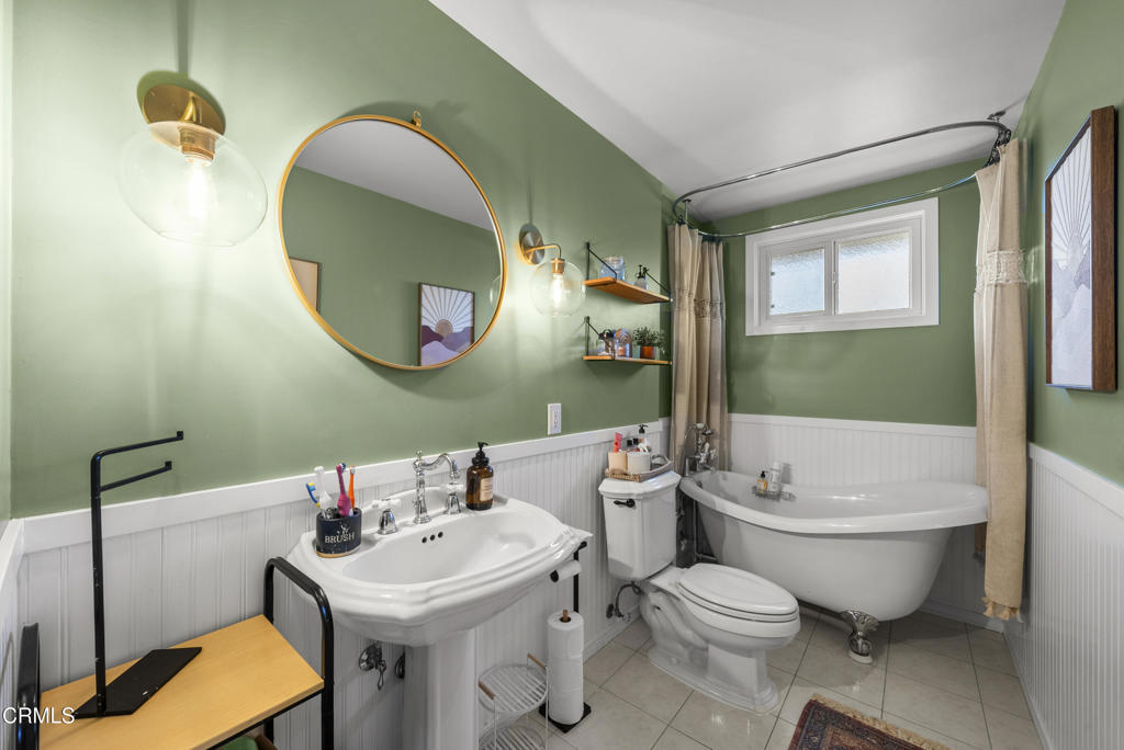 527 Keyser Rondo Camarillo, CA 93010 - Photo 17 of 42 a bathroom with a toilet sink and mirror