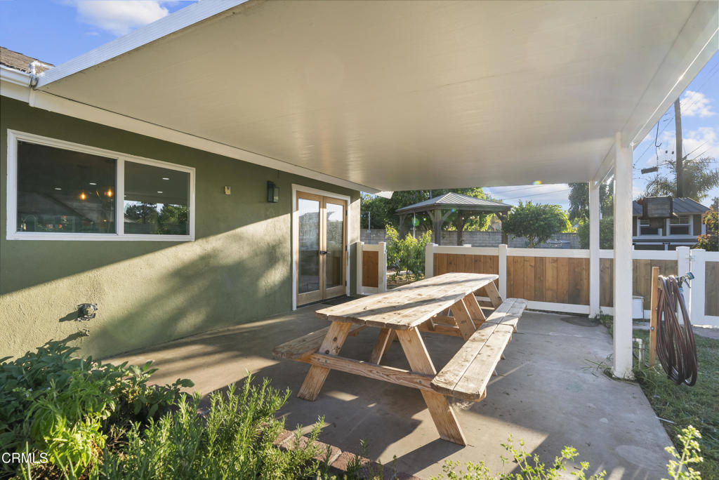 527 Keyser Rondo Camarillo, CA 93010 - Photo 35 of 42 a view of a patio with table and chairs with wooden floor and fence