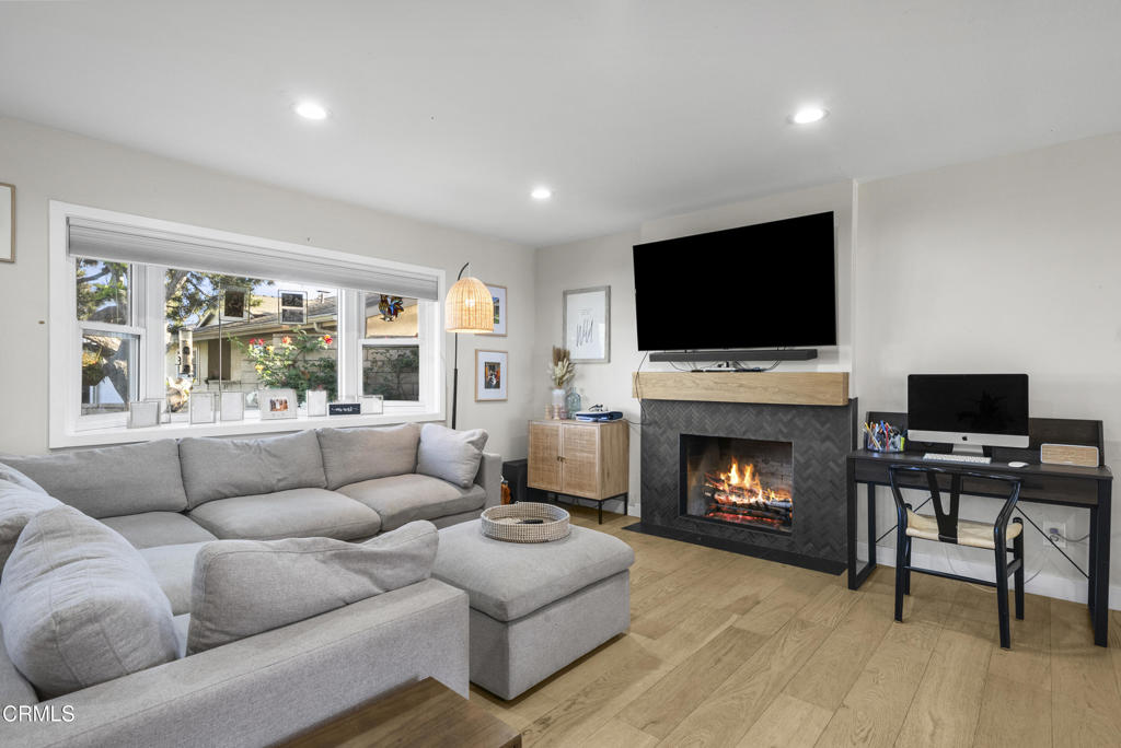 527 Keyser Rondo Camarillo, CA 93010 - Photo 8 of 42 a living room with furniture a fireplace and a flat screen tv