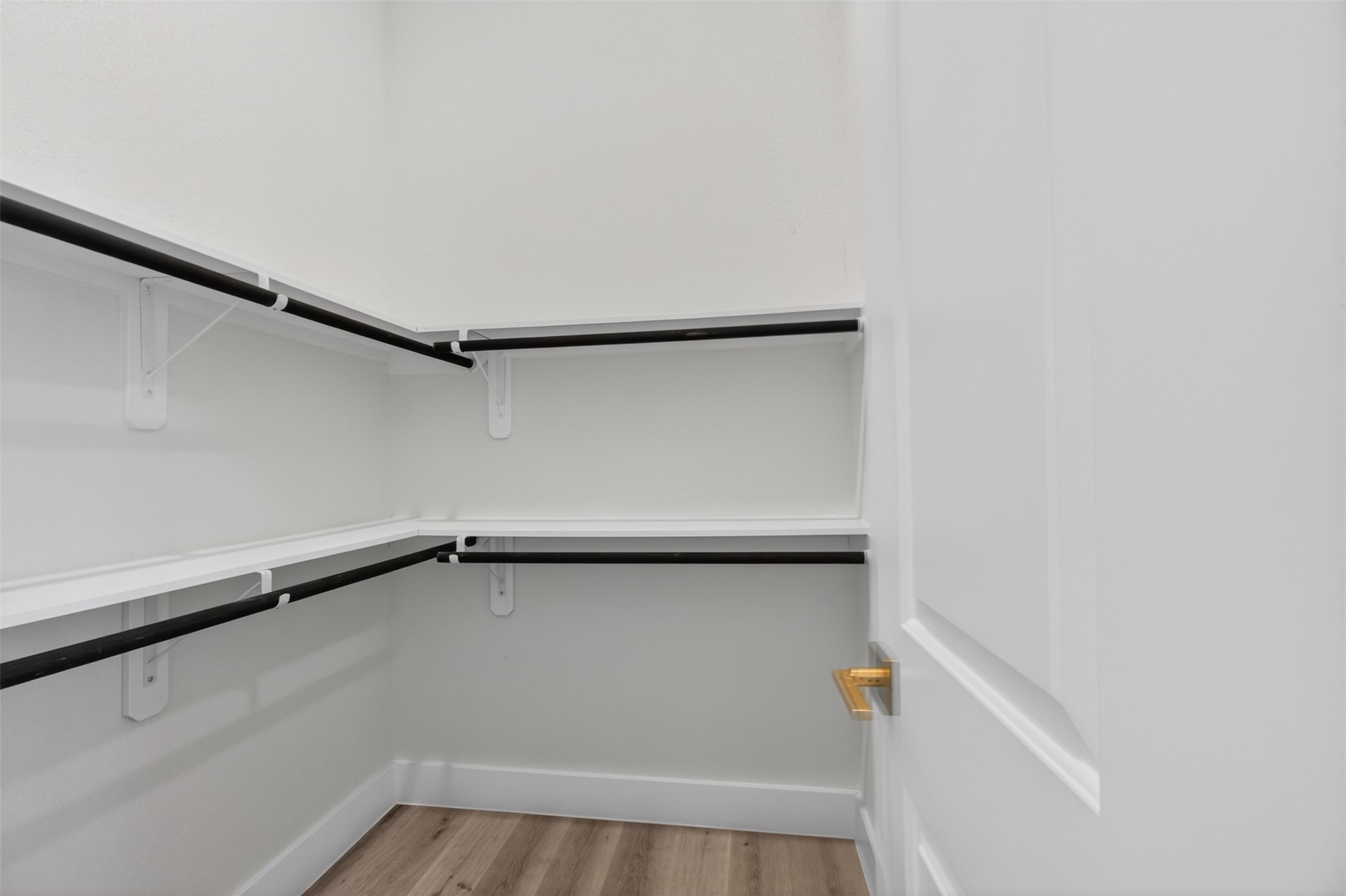 5906 St Augustine Street, Unit F Houston, TX 77021 - Photo 28 of 34 Closet with wraparound double hanging rods and built-in shelving.