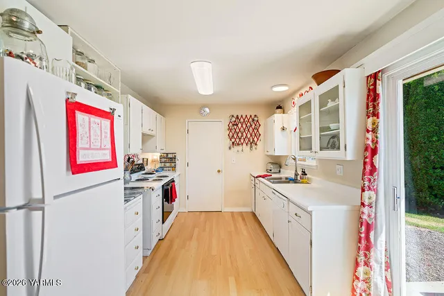 a kitchen with a sink stove and refrigerator