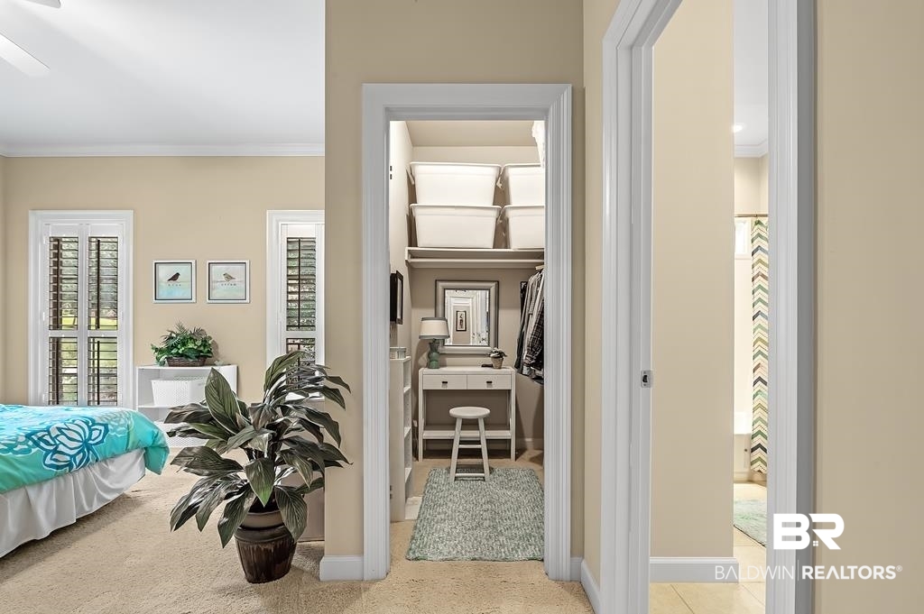 29976 Dolive Ridge Daphne, AL 36527 - Photo 36 of 58 Corridor featuring ornamental molding and light tile patterned floors