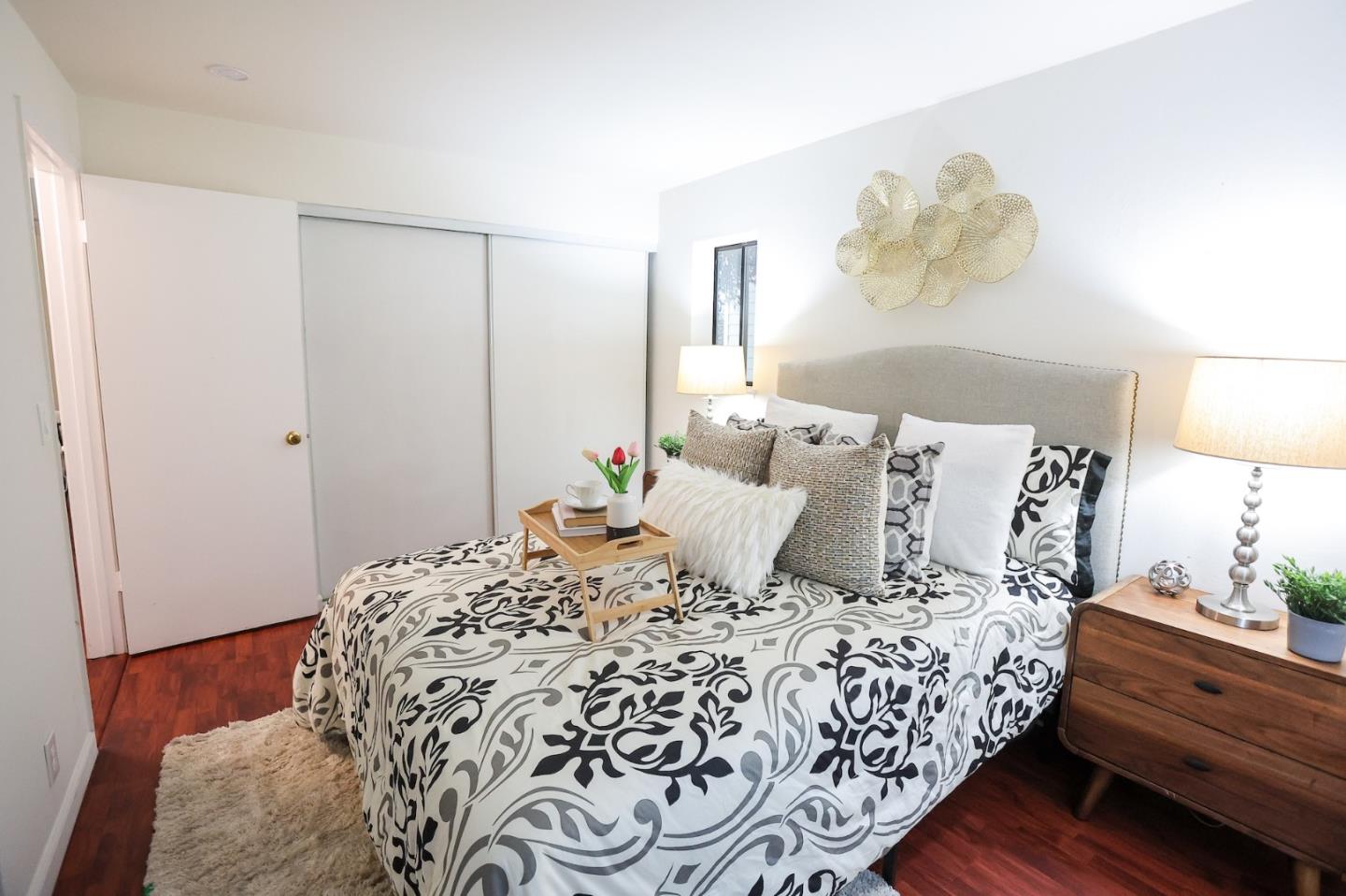 274 Stonegate Circle San Jose, CA 95110 - Photo 12 of 28 a bed room with a bed and a painting on the wall