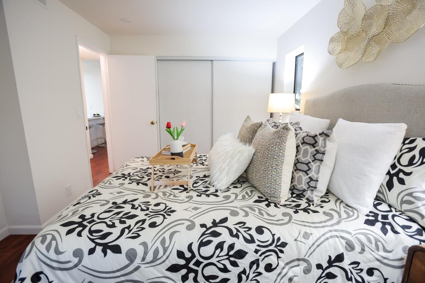 274 Stonegate Circle San Jose, CA 95110 - Photo 13 of 28 a bedroom with a bed and wooden floor