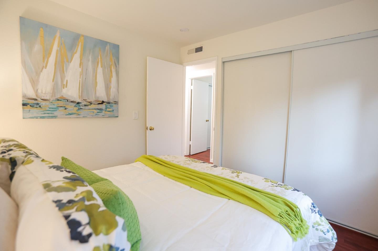 274 Stonegate Circle San Jose, CA 95110 - Photo 15 of 28 a bedroom with a bed and a window