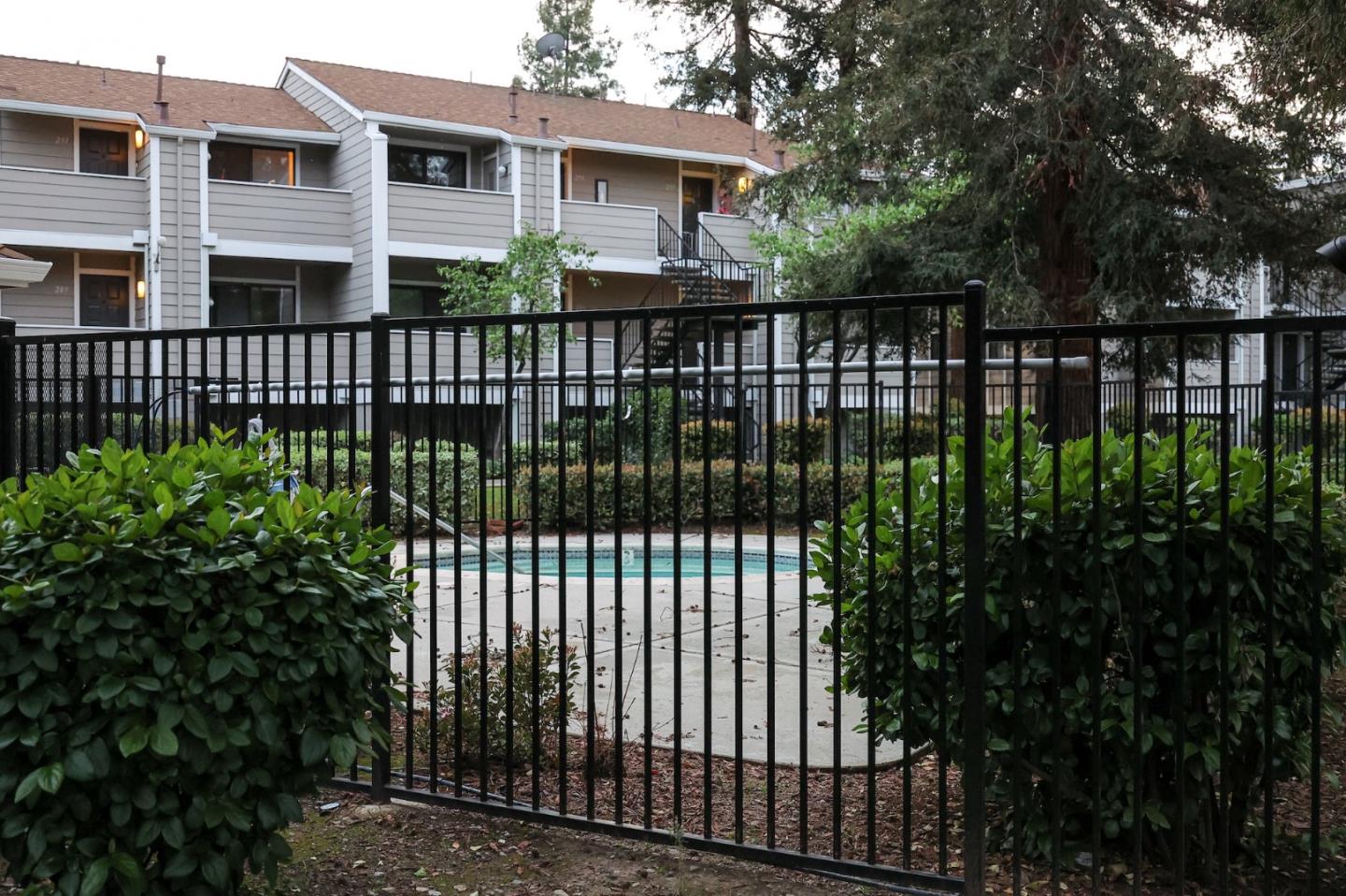 274 Stonegate Circle San Jose, CA 95110 - Photo 28 of 28 a view of a house with a small yard and floor to ceiling window
