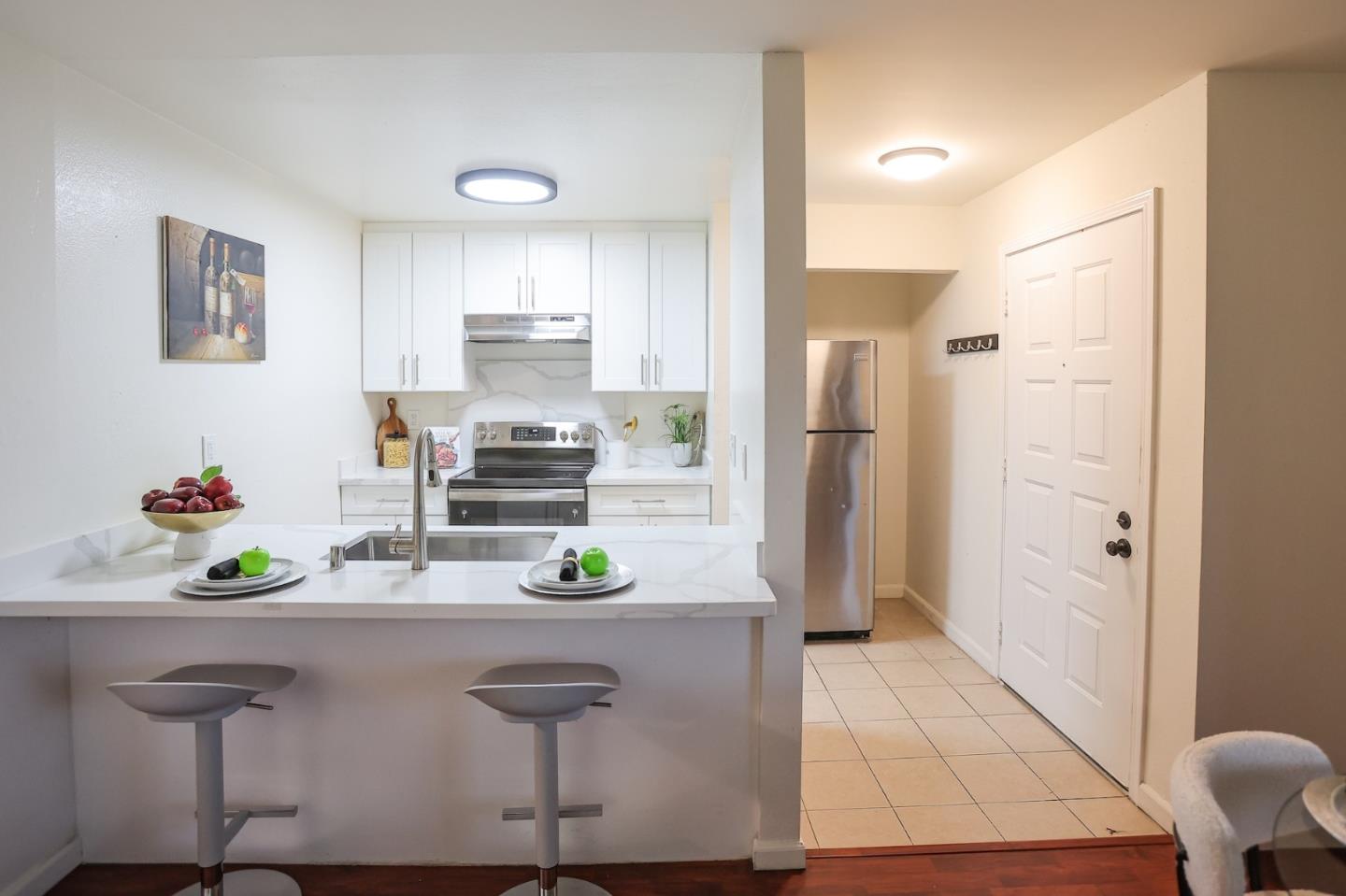 274 Stonegate Circle San Jose, CA 95110 - Photo 4 of 28 a kitchen with stainless steel appliances a refrigerator and a counter space