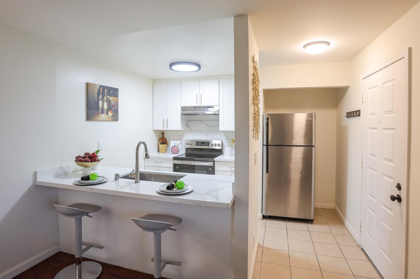 274 Stonegate Circle San Jose, CA 95110 - Photo 7 of 28 a kitchen with a refrigerator and a sink
