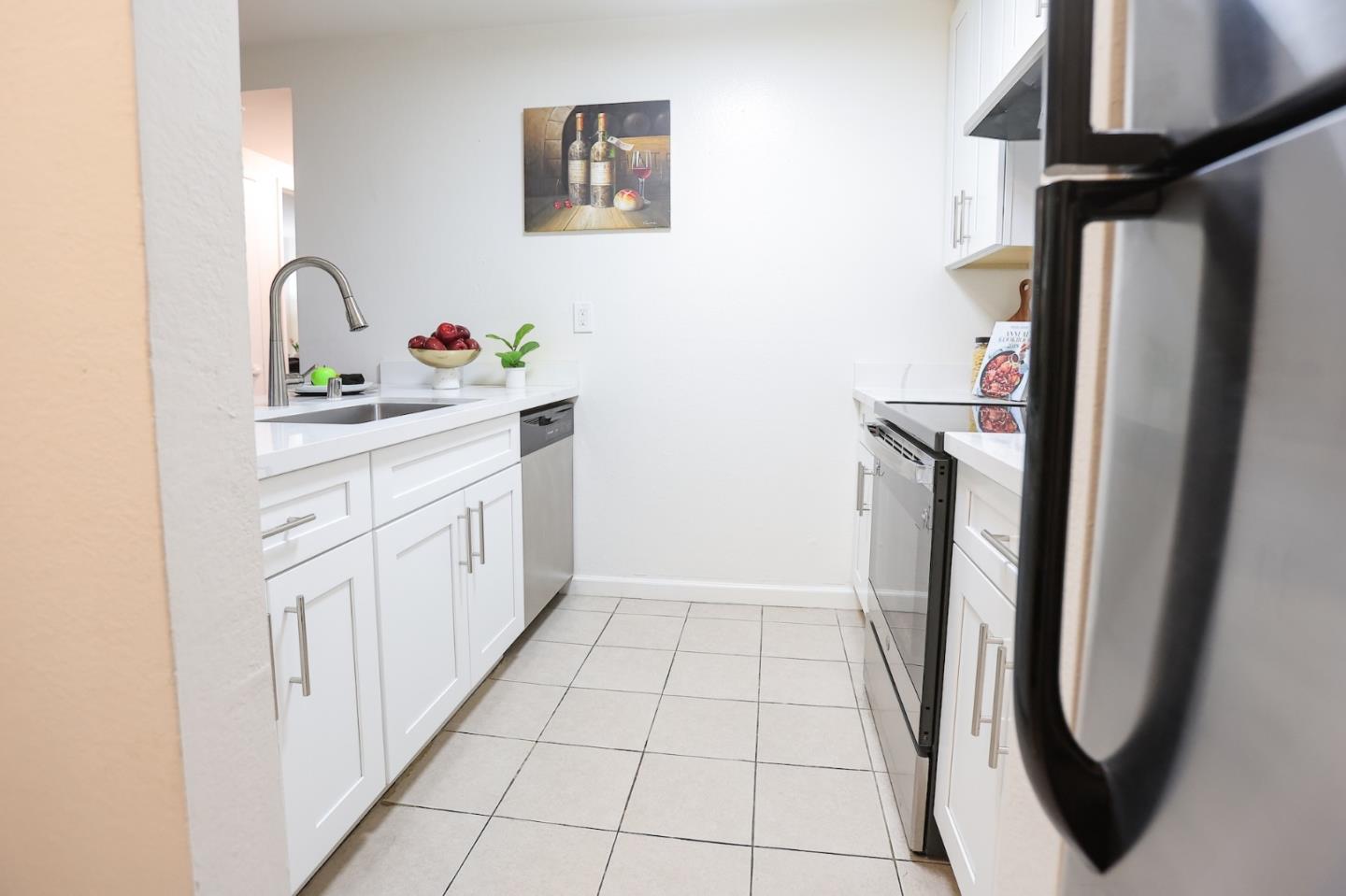 274 Stonegate Circle San Jose, CA 95110 - Photo 9 of 28 a bathroom with a sink a toilet and a mirror