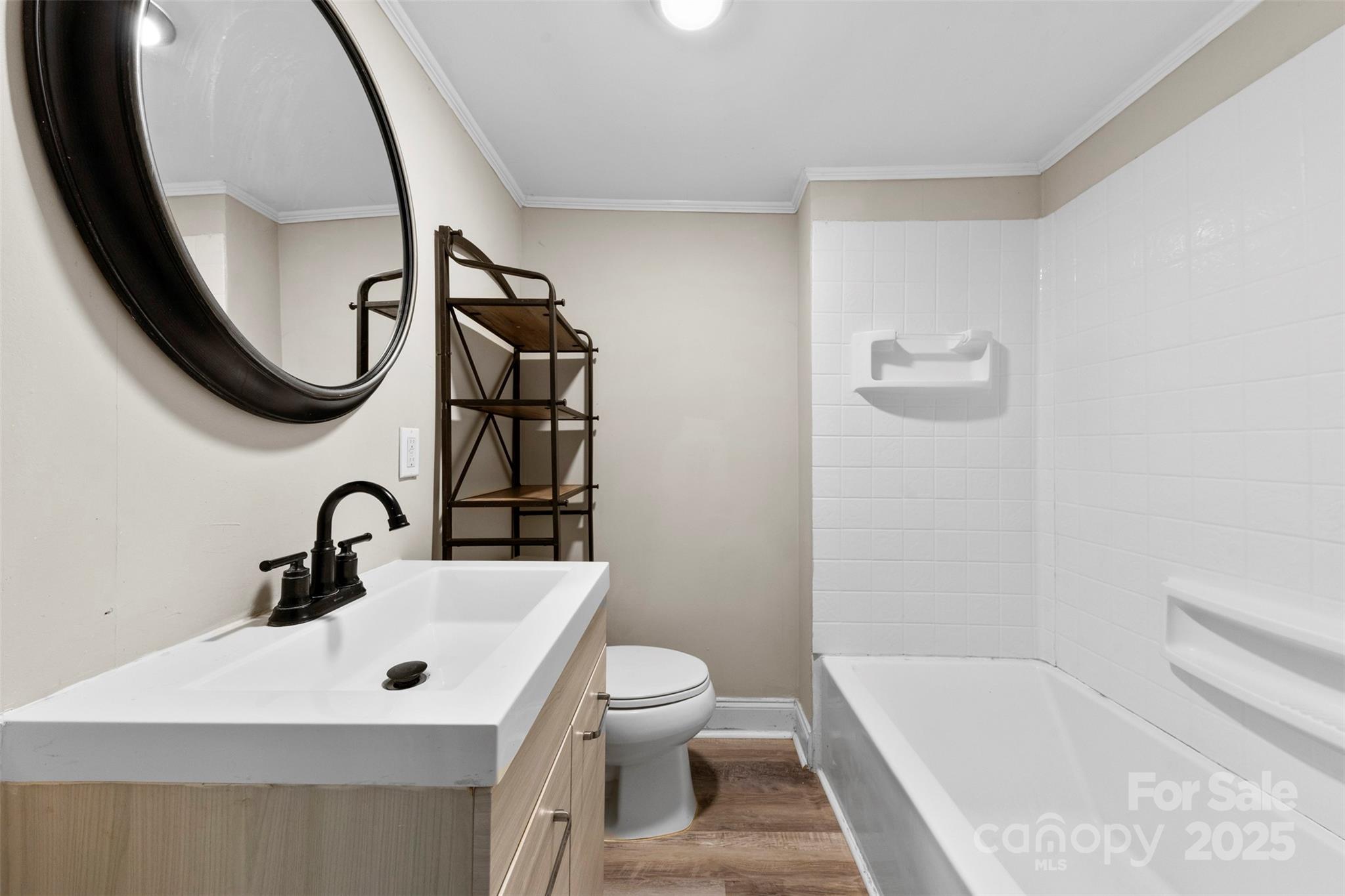 2009 Auten Road Gastonia, NC 28054 - Photo 17 of 30 a bathroom with a sink a toilet and a mirror