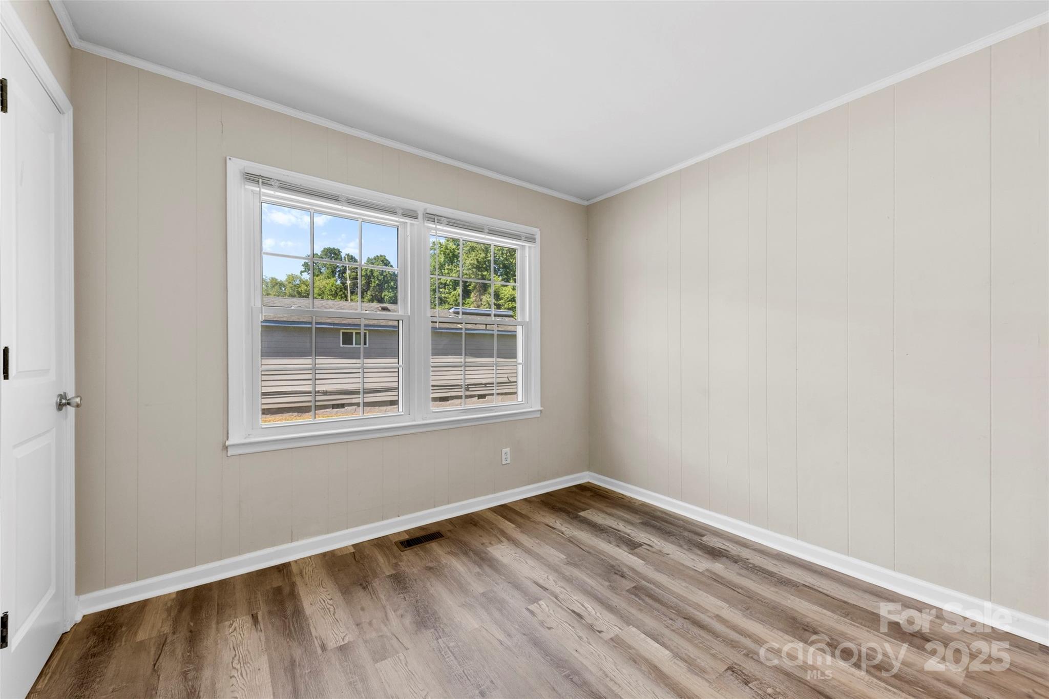 2009 Auten Road Gastonia, NC 28054 - Photo 18 of 30 an empty room with wooden floor and windows
