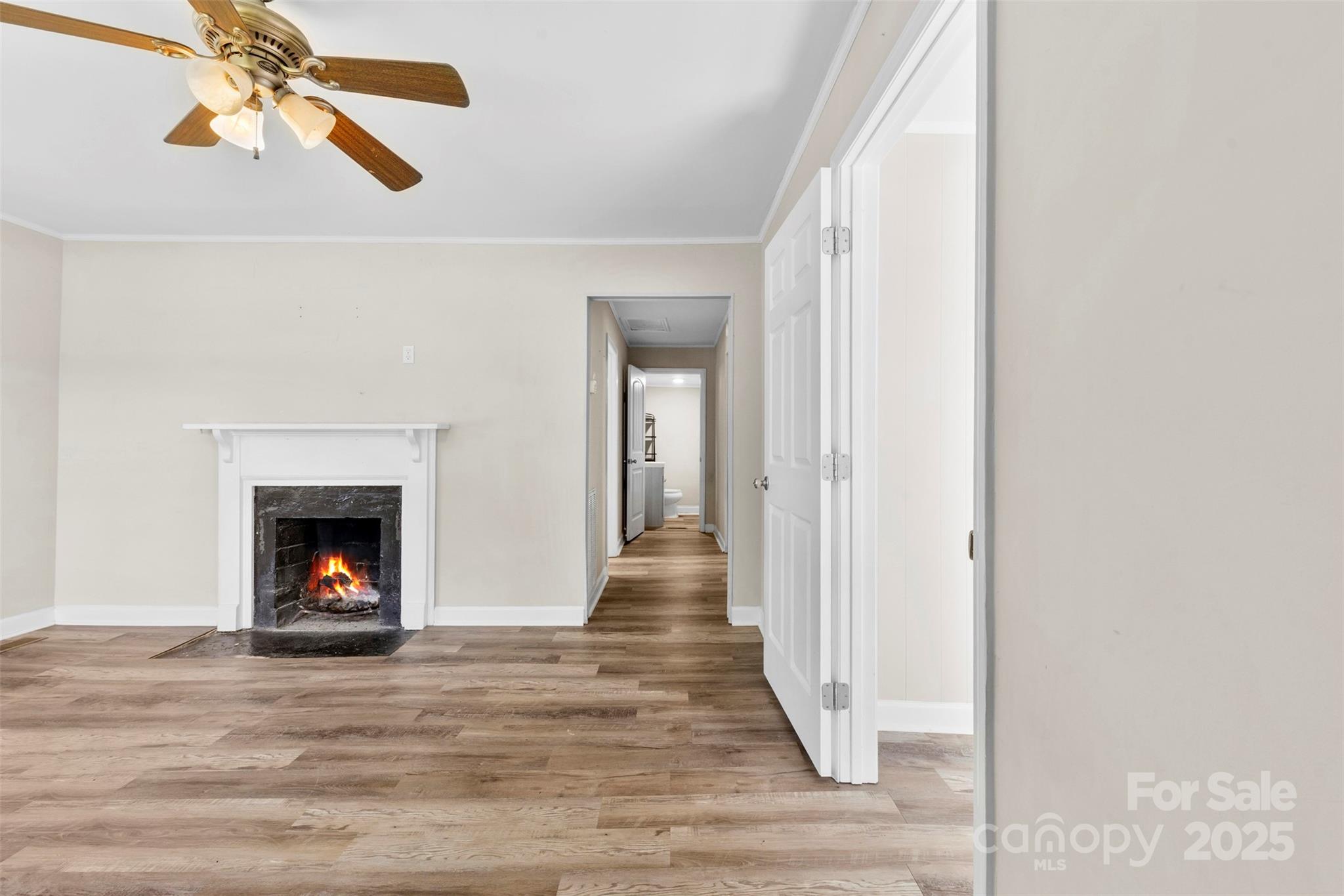 2009 Auten Road Gastonia, NC 28054 - Photo 2 of 30 a view of a livingroom with wooden floor and a fireplace