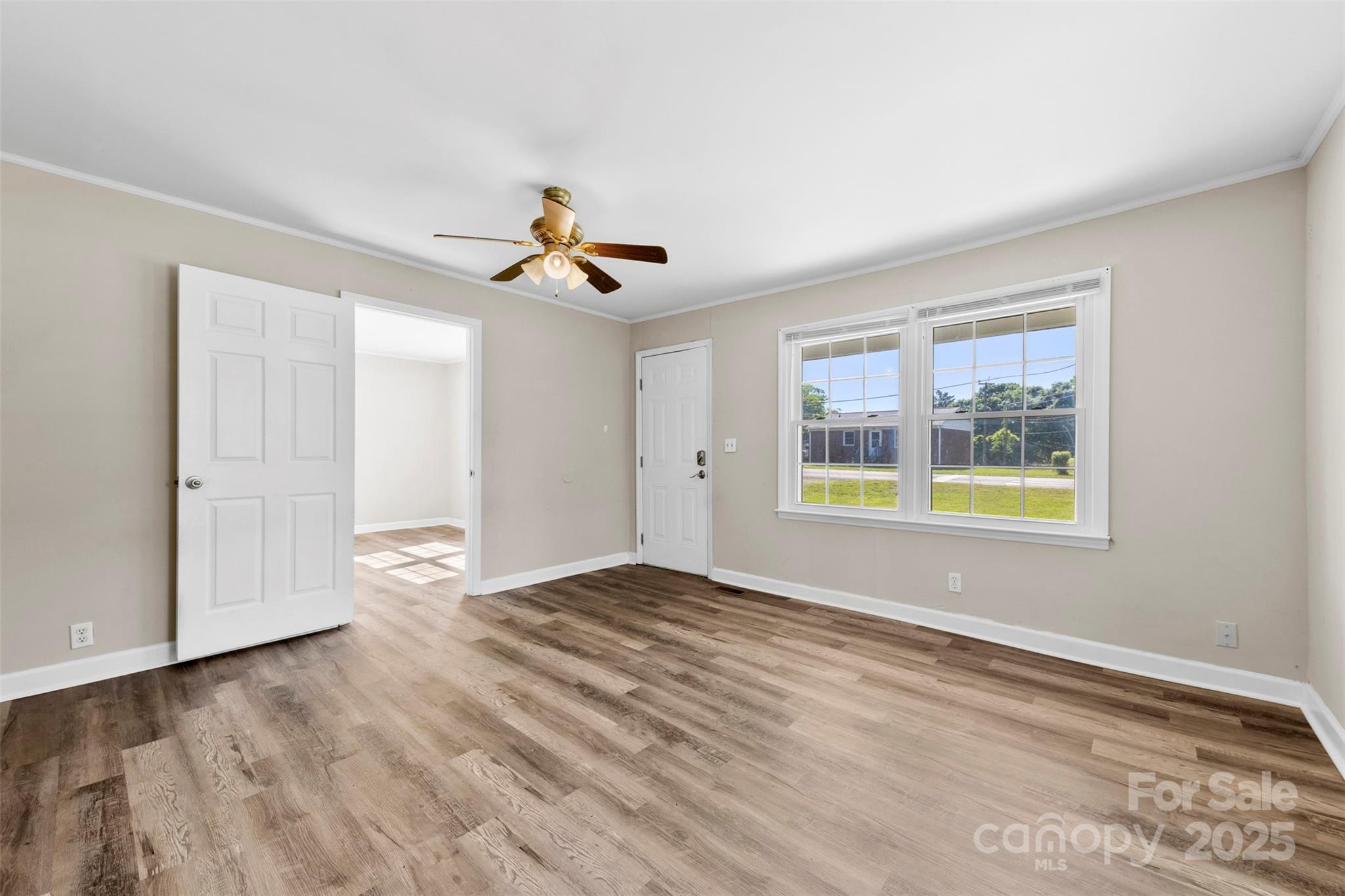 2009 Auten Road Gastonia, NC 28054 - Photo 4 of 30 a view of an empty room with window and wooden floor