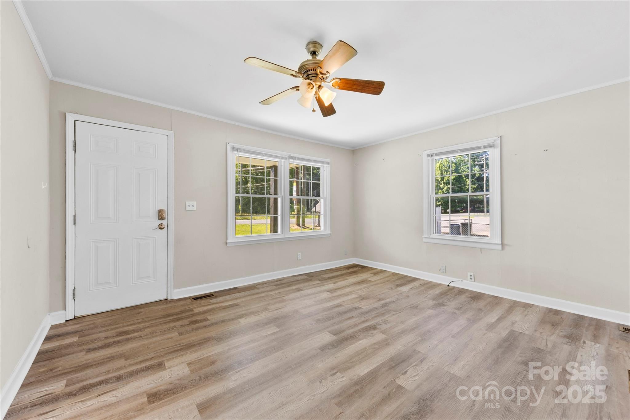 2009 Auten Road Gastonia, NC 28054 - Photo 6 of 30 a view of a livingroom with a window and a ceiling fan