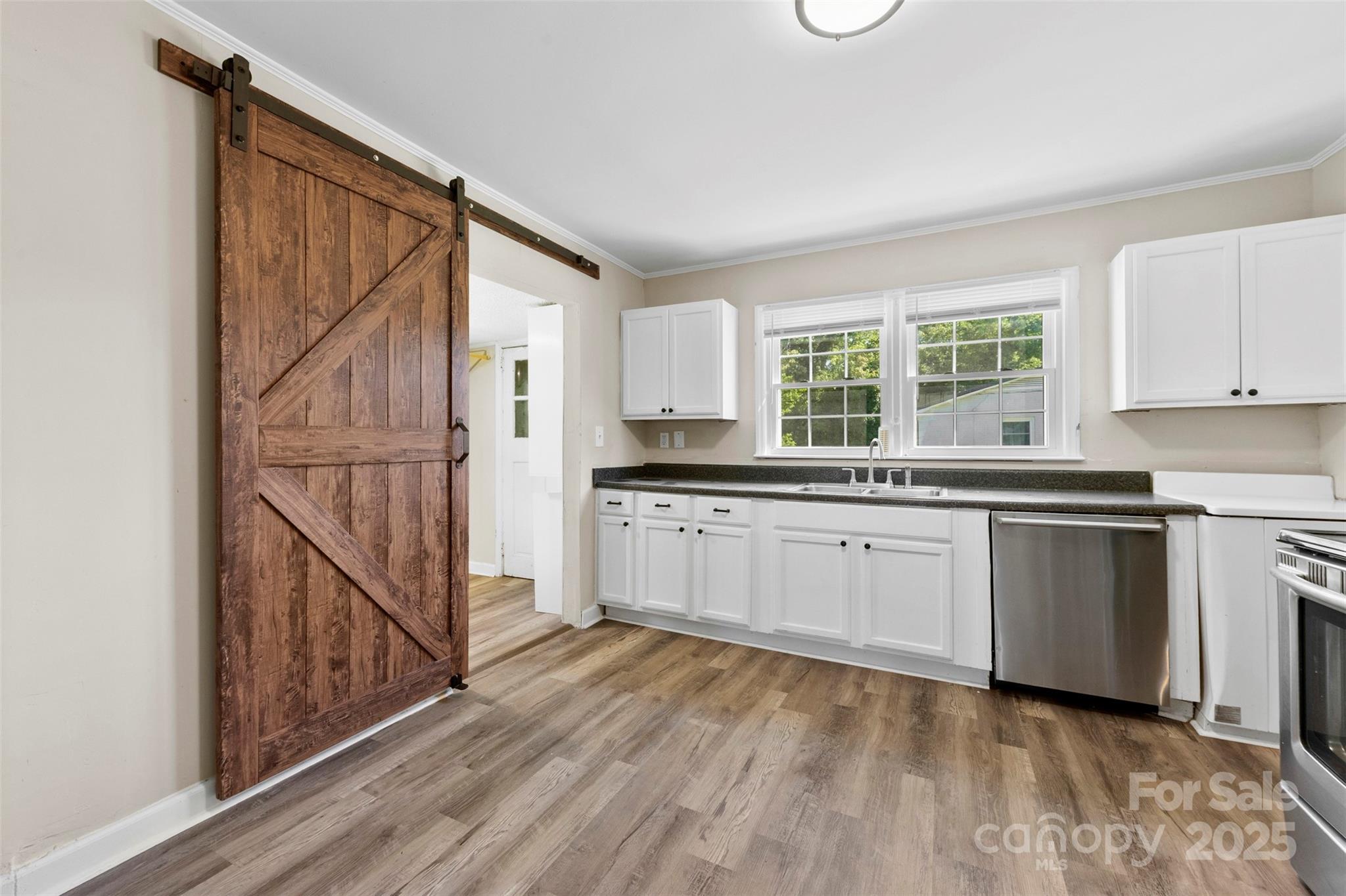 2009 Auten Road Gastonia, NC 28054 - Photo 10 of 30 a kitchen with granite countertop white cabinets and white appliances
