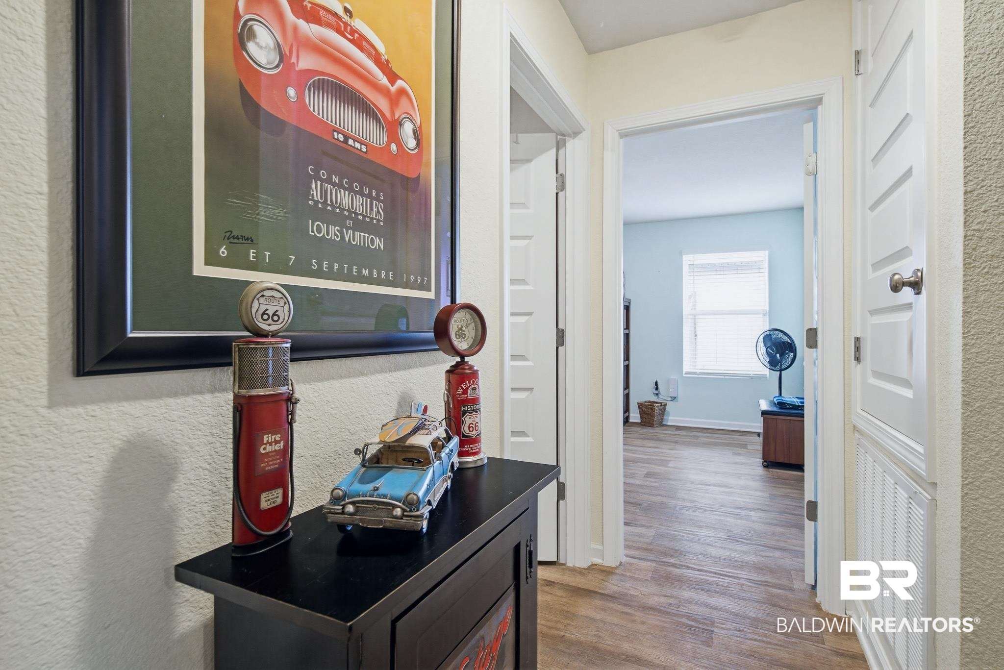 261 Fulham Lane Foley, AL 36535 - Photo 17 of 50 Hallway featuring wood finished floors and a textured wall