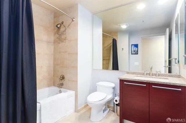a bathroom with a sink toilet tub and shower