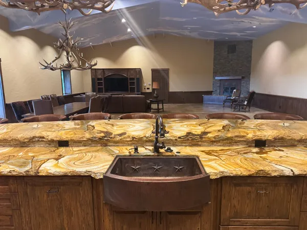 a view of a swimming pool with a table and chairs