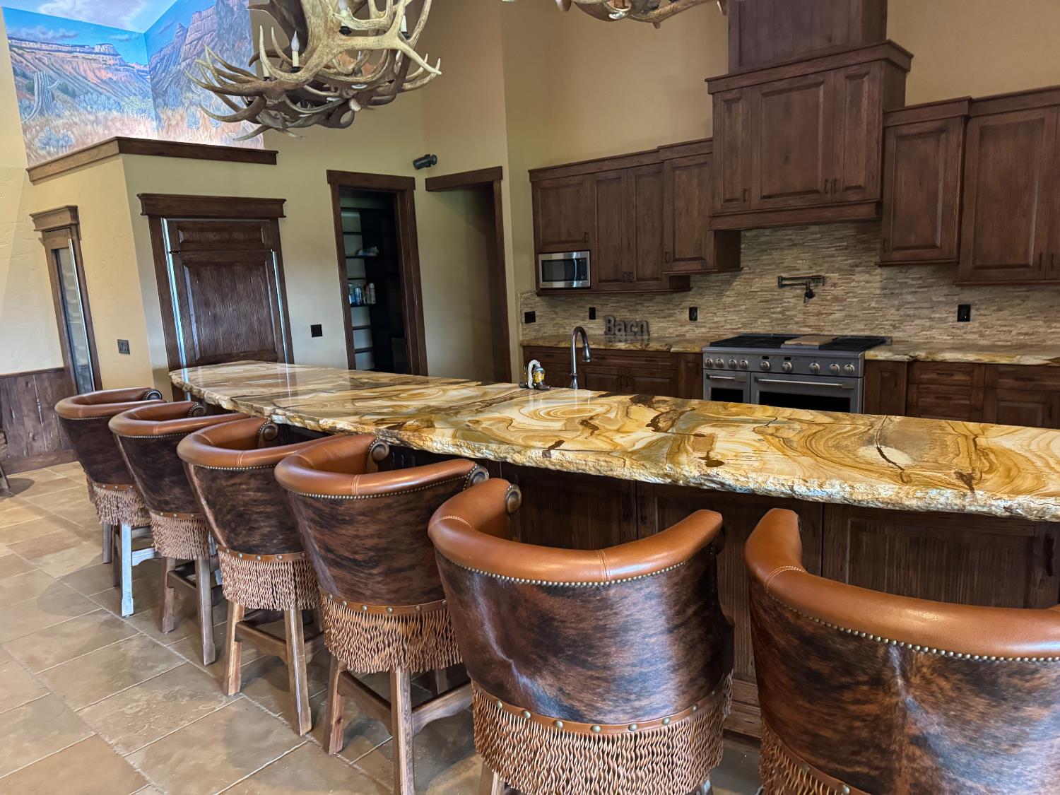 3488 River Road Colusa, CA 95932 - Photo 11 of 31 a kitchen with a table chairs sink and cabinets