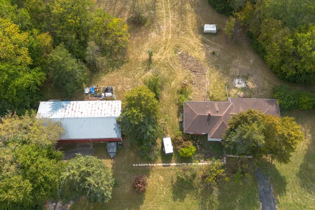 aerial view of a house with a yard