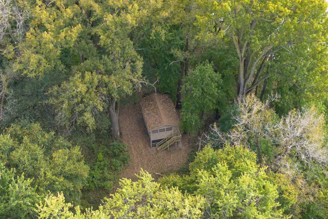 an aerial view of residential houses with outdoor space