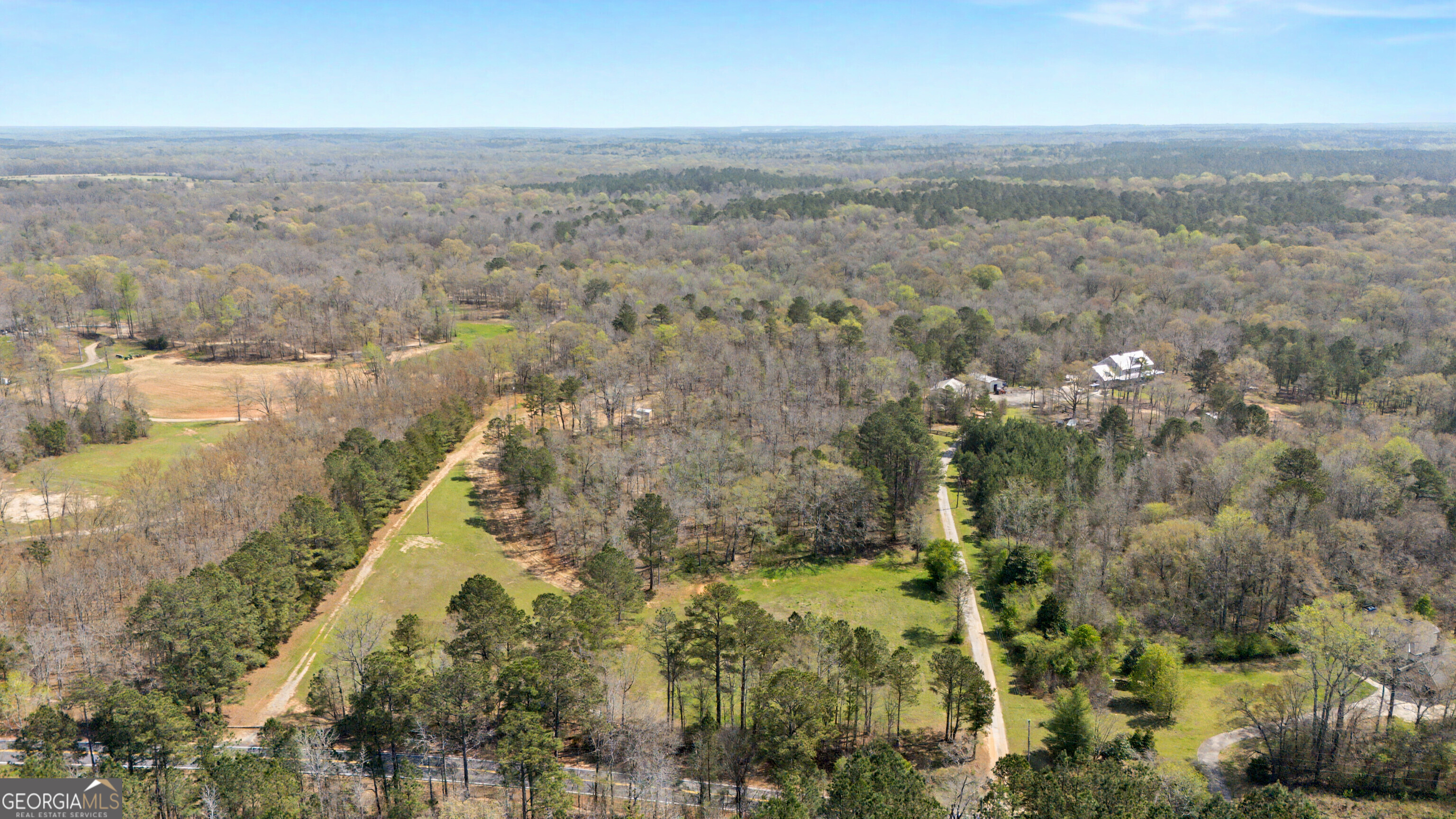 2331 Hollonville Road Brooks, GA 30205 - Photo 4 of 9 an aerial view of house with yard and mountain view in back