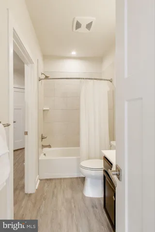 a view of a small room with a floor to ceiling window and floor to ceiling window