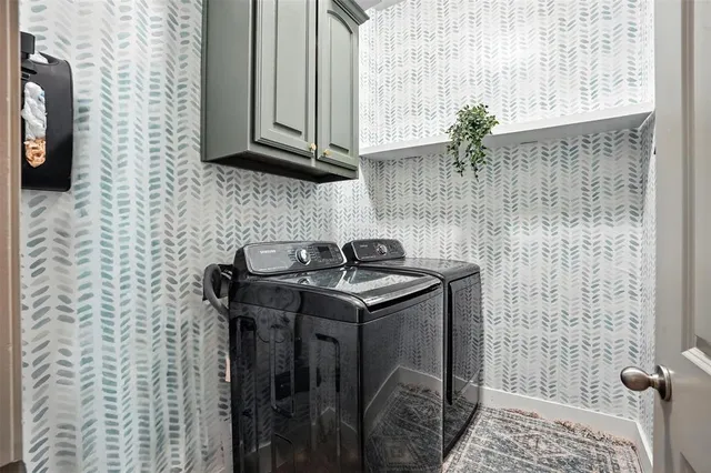 a bathroom with a sink a toilet and shower curtain