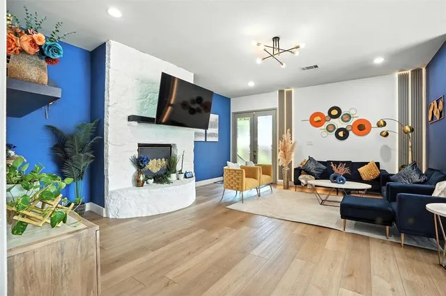 a living room with furniture fireplace and flat screen tv
