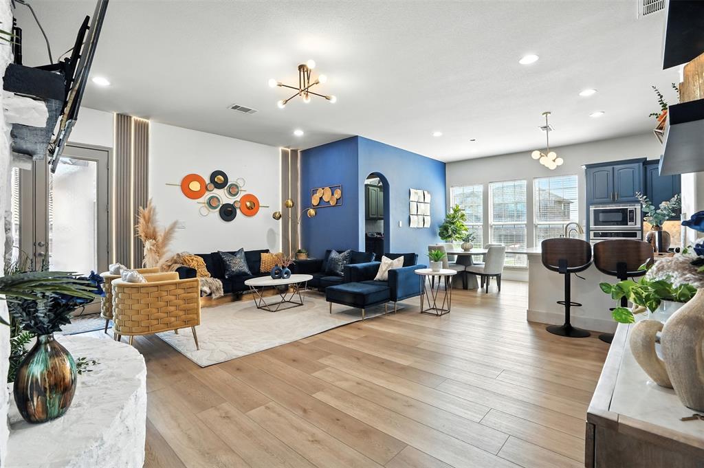 200 Thistle Ridge Denton, TX 76210 - Photo 18 of 31 a living room with furniture and wooden floor