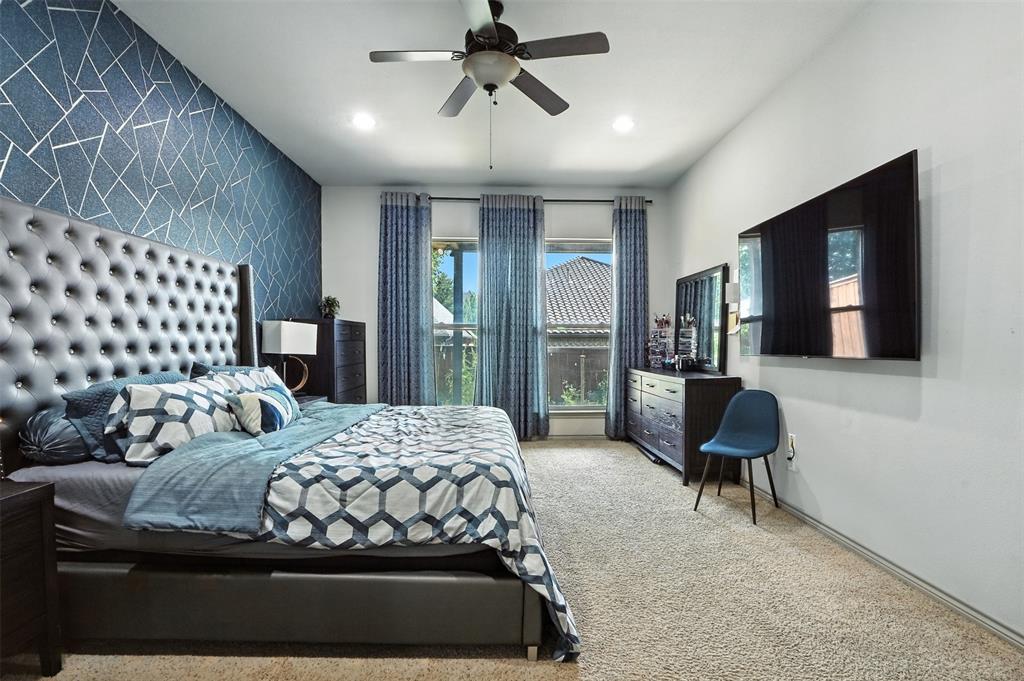 200 Thistle Ridge Denton, TX 76210 - Photo 22 of 31 a bedroom with a bed and wooden floor