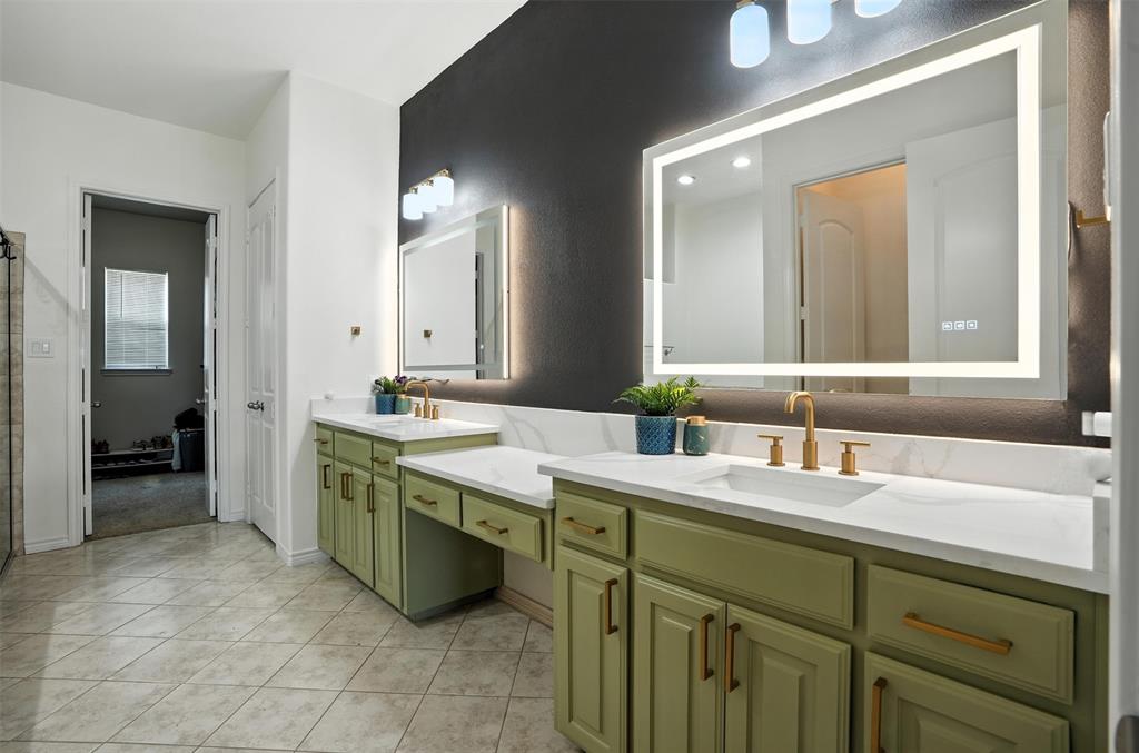 200 Thistle Ridge Denton, TX 76210 - Photo 23 of 31 a bathroom with a sink and a mirror