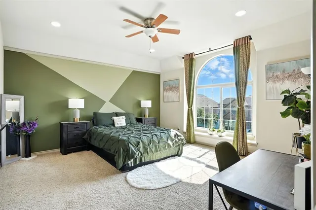 a living room with a bed and furniture