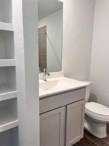 an empty room with a empty space and windows