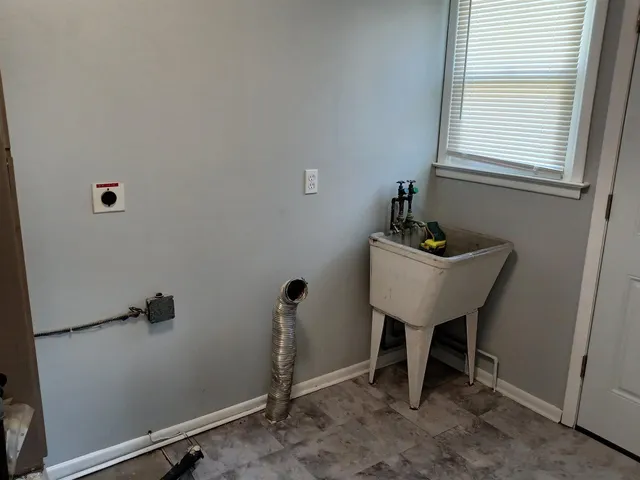 a bathroom with a sink and a window