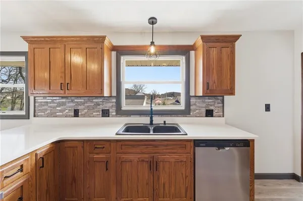 a kitchen with a sink and cabinets