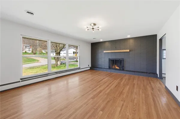 a view of a room with wooden floor