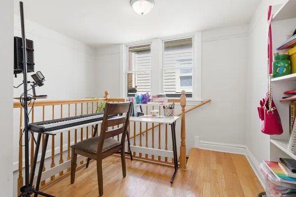a view of a room with furniture window and wooden floor