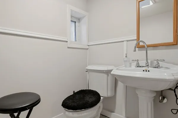 a living room with lots of furniture and gym equipment