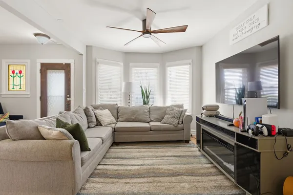 a living room with furniture and a large window