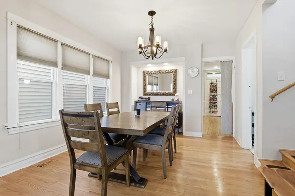 a view of a dining room with furniture and window