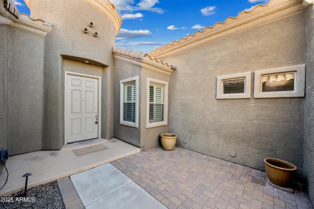 a view of a livingroom with wooden floor and a window