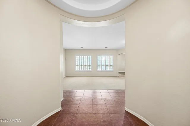 a view of an empty room and window