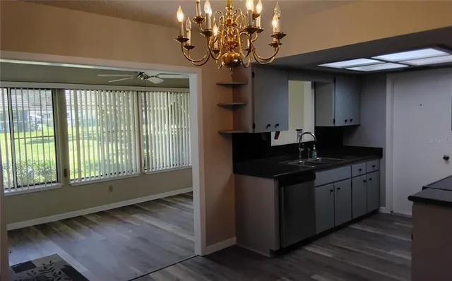 a kitchen with a sink and stove